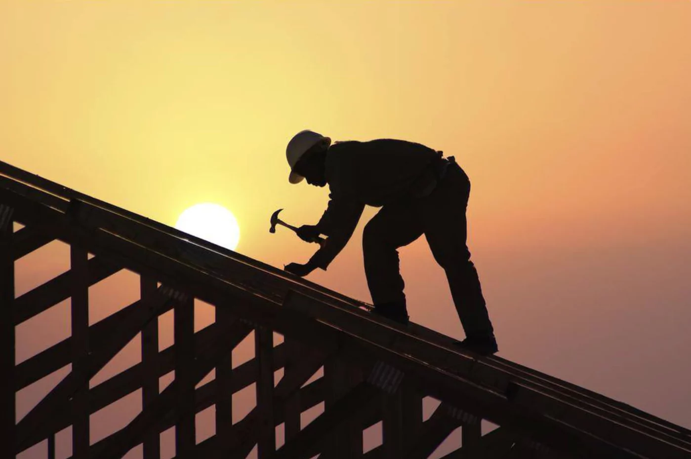 man working on roof